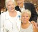 Mimie Mathy et son mari Benoît ont posé avec plaisir aux côtés de Line Renaud, sacrée Grand Officier à l"Ordre National du Mérite, au Palais de l"Elysée, mardi 30 juin 2009