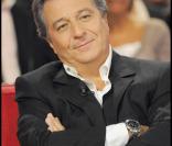 Christian Clavier sur le plateau de  Vivement Dimanche .