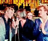 Eddy Mitchell, Gérard Depardieu et Johnny Halliday à la télévision, en 1980. 