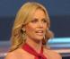Charlize Theron dans une ravissante robe rouge pour décider du sort des équipes de foot à l'occasion de la coupe du monde... "J'adore" !