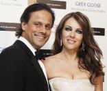  Liz Hurley et son mari Arun Nayar lors de la soirée Winter Ball organisée par la Elton John AIDS Foundation à l'ambassade américaine à Londres le 30 octobre 2010 