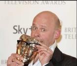 L'humoriste Harry Hill lors de la soirée des remises des BAFTA