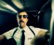 Bligg dans le clip Au Poste, de Stress