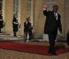 Carla Bruni-Sarkozy et Nicolas Sarkozy posent devant le seuil du palais présidentiel de l'Elysée avec Alassane  Ouattara, président ivoirien, et son épouse Dominique Ouattara, le 26 janvier 2012, à l'occasion d'un dîner d'Etat 