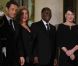 Carla Bruni-Sarkozy et Nicolas Sarkozy posent devant le seuil du palais présidentiel de l'Elysée avec Alassane  Ouattara, président ivoirien, et son épouse Dominique Ouattara, le 26 janvier 2012, à l'occasion d'un dîner d'Etat 