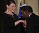 Carla Bruni-Sarkozy et Nicolas Sarkozy posent devant le seuil du palais présidentiel de l'Elysée avec Alassane  Ouattara, président ivoirien, et son épouse Dominique Ouattara, le 26 janvier 2012, à l'occasion d'un dîner d'Etat 
