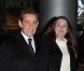 Nicolas Sarkozy, souriant et décidé, et Carla Bruni arrivent dans les locaux de TF1 juste avant sa déclaration au journal télévisé de 20 heures de Laurence Ferrari, à Paris, le 15 février 2012.