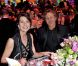 La princesse Caroline à table avec Renzo Rosso. Le Bal de la Rose 2012, sous l'impulsion de la princesse Caroline de Monaco, présidente de la Fondation Princesse Grace, a mis la Salle des Etoiles du Sporting Club de Monaco à la mode folle, colorée et rock du Londres des années 1960, Swinging London, le 24 mars 2012.