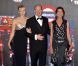  Le prince Albert, entouré de Charlene (en Akris) et de Caroline (en Chanel), au Bal de la Rose le 24 mars 2012. 
 Le Bal de la Rose 2012, sous l'impulsion de la princesse Caroline de Monaco, présidente de la Fondation Princesse Grace, a mis la Salle des Etoiles du Sporting Club de Monaco à la mode folle, colorée et rock du Londres des années 1960, Swinging London, le 24 mars 2012. 