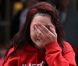 Les fans en larmes après avoir aperçu Justin Bieber à son arrivée à Londres, le 23 avril 2012.