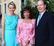 Joan Collins entre la princesse Charlene et le prince Albert de Monaco lors d'un cocktail en marge du 52e Festival international de télévision de Monte-Carlo, le 13 juin 2012.