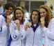 Camille Muffat, Charlotte Bonnet, Ophelie-Cyrielle Etienne et Coralie Balmy heureuses après avoir décroché le bronze olympique lors du relais 4x200 m nage libre lors des Jeux olympiques de Londres le 1er août 2012