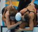 Camille Muffat, Charlotte Bonnet, Ophelie-Cyrielle Etienne et Coralie Balmy heureuses après avoir décroché le bronze olympique lors du relais 4x200 m nage libre lors des Jeux olympiques de Londres le 1er août 2012