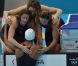 Camille Muffat, Charlotte Bonnet, Ophelie-Cyrielle Etienne et Coralie Balmy heureuses après avoir décroché le bronze olympique lors du relais 4x200 m nage libre lors des Jeux olympiques de Londres le 1er août 2012