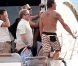Elton John, entouré d'amis sur un yacht, montre ses fesses aux photographes au large de St-Tropez, le lundi 13 août 2012.