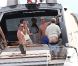 Elton John, entouré d'amis sur un yacht, montre ses fesses aux photographes au large de St-Tropez, le lundi 13 août 2012.