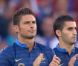  Olivier Giroud applaudissant à la mémoire de Thierry Roland. 
 Deux mois après sa mort, Thierry Roland a été honoré le 15 août 2012 par une standing ovation d'une minute d'applaudissements en préambule au match France-Uruguay au stade Océane du Havre. 