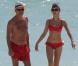 Exclusif - La sexy Olga Kurylenko et son compagnon Danny Huston forment un couple assorti en rouge sur la plage. Miami, le 16 octobre 2012.