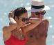 Exclusif - La sexy Olga Kurylenko et son compagnon Danny Huston forment un couple assorti en rouge sur la plage. Miami, le 16 octobre 2012.