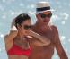 Exclusif - La sexy Olga Kurylenko et son compagnon Danny Huston forment un couple assorti en rouge sur la plage. Miami, le 16 octobre 2012.