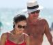 Exclusif - La sexy Olga Kurylenko et son compagnon Danny Huston forment un couple assorti en rouge sur la plage. Miami, le 16 octobre 2012.