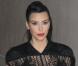 Kim Kardashian porte une robe en dentelle Lover et des sandales Saint Laurent. Hollywood, le 29 janvier 2013.