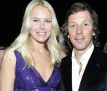 Valeria Mazza et son époux au défilé Versace lundi à Milan