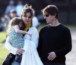 Tom, Katie et Suri Cruise le 10 octobre à Boston. Le couple fête leur troisème anniversaire de mariage, le 18 novembre 2009. 