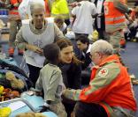 Carla Bruni Sarkozy le 22 janvier à Roissy pour accueillir les 33 orphelins haïtiens