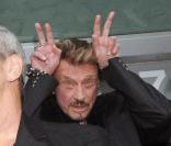 Pascal Obispo, Laeticia Hallyday, Jean-Claude Darmon et Johnny au concert d'ACDC, le 18 juin 2010 au Stade de France.