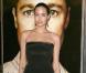 Angelina Jolie dans une longue robe bustier Versace lors de la première de Benjamin Button à Los Angeles