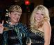 Jeane Manson et Célyne Durand lors de la présentation de la collection printemps-été 2011 de Christophe Guillarmé au Balajo à Paris le 29 septembre 2010