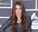 Miley Cyrus aux Grammy Awards le 31 janvier 2010, avec une robe Hervé Leger qu'elle a d'ailleurs vendue aux enchères sur Ebay pour récolter des fonds après le tremblement de terre à Haïti.