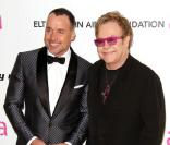 Elton John et son mari David Furnish à la 19ème édition de la Elton John AIDS Foundation organisé à Los Angeles, le 27 février 2011.