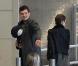 Orlando Bloom et Miranda Kerr arrivent à l'aéroport de Paris avec leur adorable bébé, le 2 mars 2011.