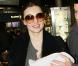 Orlando Bloom et Miranda Kerr arrivent à l'aéroport de Paris avec leur adorable bébé, le 2 mars 2011.