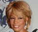 Quelques mois avant son divorce, Whitney Houston rayonne à un bal de charité, à Los Angeles, en 2006. 