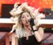 La chanteuse Fergie reforce son partenariat avec la marque de cosmétiques Avon et devient égérie de leur kit de coloration. Londres, le 1er juillet 2011.