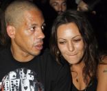 Karole Rocher et JoeyStarr au défilé Givenchy à Paris en octobre 2011