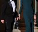Carla Bruni dans la robe Lombard de Roland Mouret, dans sa teinte bleu canard originale, lors du dîner d'Etat donné à l'Elysée le 2 mars 2010 en l'honneur du président russe Dmitry Medvedev et sa femme Svetlana. Une robe qui a fait jaser, en raison de l'absence de soutien-gorge dessous...