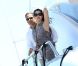 Moment de complicité pour Eric Besson et son épouse Yasmine à bord d'un yacht au large de Saint-Tropez, le 12 juillet 2012.