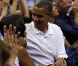 Michelle et Barack Obama assistent à un match de l'équipe olympique féminine de basket contre le Brésil, à Washington, le 16 juillet 2012