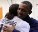 Michelle et Barack Obama assistent à un match de l'équipe olympique féminine de basket contre le Brésil, à Washington, le 16 juillet 2012