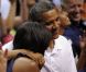 Michelle et Barack Obama assistent à un match de l'équipe olympique féminine de basket contre le Brésil, à Washington, le 16 juillet 2012