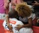 Teddy Riner dans les bras de sa compagne Luthna lors des Jeux olympiques de Londres le 3 août 2012 après avoir décroché la médaille d'or