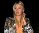 Maria Sharapova heureuse après avoir célébré sa médaille d'argent chez Zuma à Londres le 4 août 2012