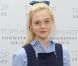 Elle Fanning lors du défilé Unique printemps-été 2013 à Londres. Le 16 septembre 2012.