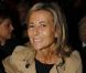 Claire Chazal, souriante au premier rang du défilé Carven printemps-été 2013 au Grand Palais. Paris, le 27 septembre 2012.