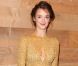 Charlotte Le Bon, stylée dans une robe Carven collection automne 2012, s'apprête à assister au défilé printemps-été 2013 de la maison française au Grand Palais. Paris, le 27 septembre 2012.