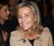Claire Chazal, souriante au premier rang du défilé Carven printemps-été 2013 au Grand Palais. Paris, le 27 septembre 2012.